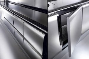 A split image showing a modern, sleek stainless steel kitchen with handleless drawers on the left and a close-up of an open freezer drawer on the right.