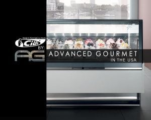 A modern gelato display case filled with various colorful gelato flavors sits in a sleek, contemporary shop; text reads “Advanced Gourmet in the USA” and shows company logos.