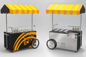 Two ice cream carts with yellow-and-black striped awnings; one cart has decorative black and yellow swirls, both have metal surfaces, serving containers, bottles, and wheels, set against a plain background.