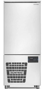 A stainless steel TECHFROST commercial freezer or blast chiller with a solid door, ventilation grid, control panel, and four legs.