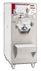 A commercial stainless steel ice cream or gelato machine with a digital control panel, dispensing spout, and a tray for holding containers, standing on wheels for mobility.